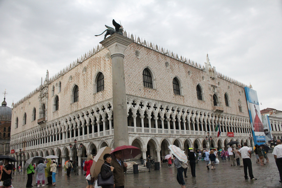 San Marco - At the foreground is the city symbol, winged lion. Behind is the Palazzo Ducale; the residence of the Doge of Venice, now a musuem. - Napolean called this place the "drawing room of Europe"